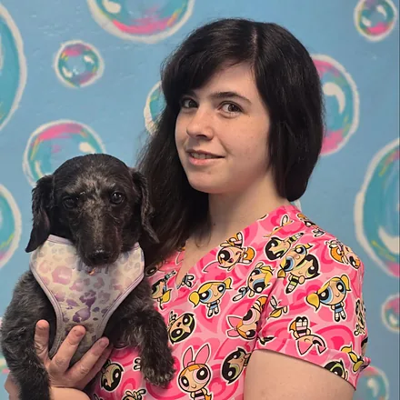 Nicole, groomer at Essential Grooming & Wellness.